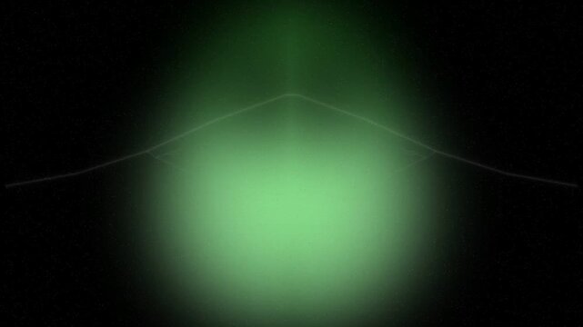 A glowing green orb surrounded by thin white lines against a dark environment from a straight-on viewpoint