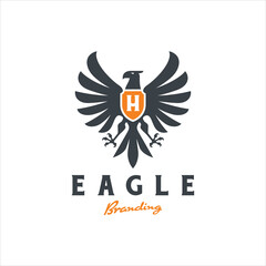 Heraldic Eagle Hawk Falcon Bird With Shield on Chest and Changeable Initials Logo Design