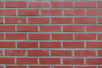 Obraz premium Title Classic Red Brick Wall with Clean Horizontal Lines and Urban TextureDescription Evenly laid bricks form a strong geometric pattern with timeless architectural feel