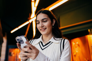 Woman happily browsing smartphone with vibrant emotion, representing joy of digital life and...
