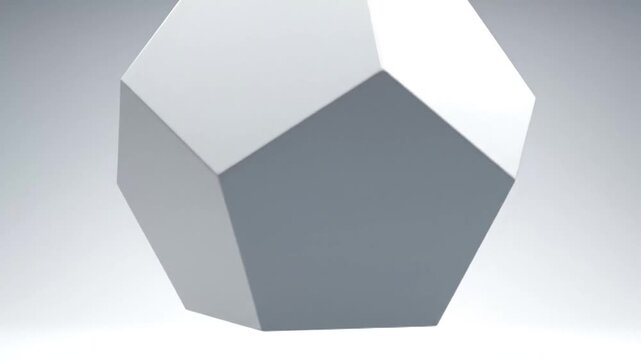 Abstract geometric polyhedron with smooth white facets and sharp edges, rendered in 3d on a soft gray gradient background with subtle lighting.