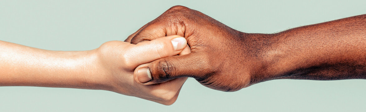 Helping hand. African and caucasian hands. Helping hand, rescue