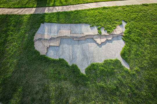 Aerial view of the United States map made of concrete surrounded by bright green grass, Underwood, Iowa, United States.