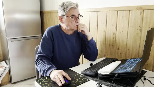 grandfather figure using a computer setup that might typically be associated with a younger demographic, highlighting the blurring lines of technology usage across ages.