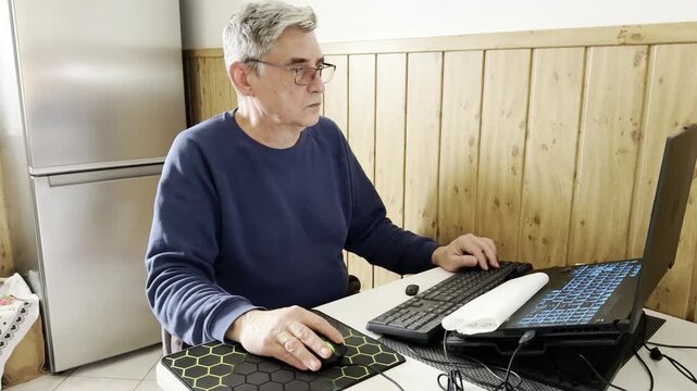senior male subject demonstrates high digital proficiency while operating a laptop computer for entertainment purposes, challenging the notion that older adults struggle with modern user interfaces.