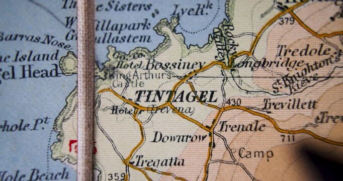 Footage old historical map from 1900 showing the city of Tintagel or Trevena is a civil parish and village situated on the Atlantic coast of Cornwall with a pan circling the city with a black marker