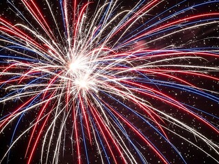 Red, White, and Blue Fireworks Display Lighting Up the Night Sky