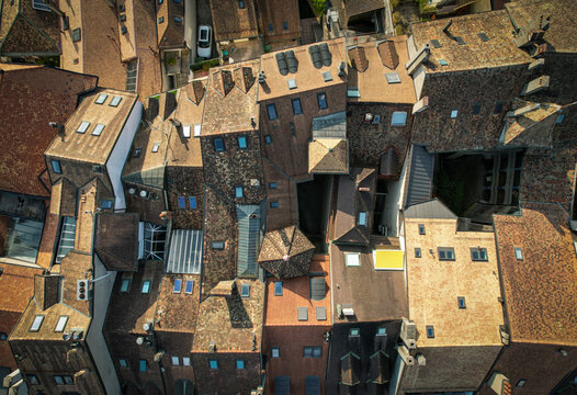 Aerial view of a tapestry of terracotta rooftops and quaint dormer windows create a warm and inviting scene, Morges, Vaud, Switzerland.
