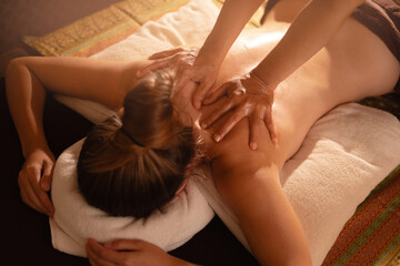 Top view Relaxing thai massage for female client in tranquil spa setting
