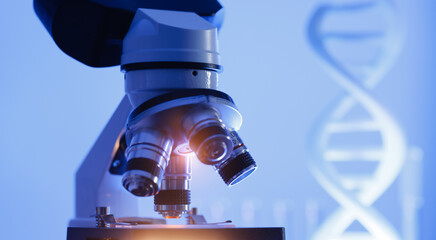 Microscope in laboratory with dna structure background, genetic engineering concept