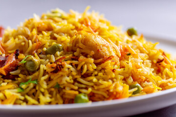 A plate of flavorful and aromatic pulao dish with rice and vegetables served hot