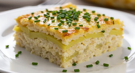 Close-up of baked potato and rice casserole with golden crust topped with fresh chopped chives, ideal for illustrating hearty homemade meals and comfort food recipes