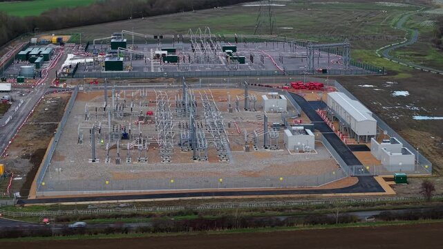 Aerial view of Biggleswade National Grid 400/132kV Substation, an electrical substation with gray gravel and green surroundings, Biggleswade, Biggleswade, United Kingdom.