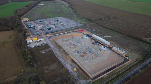 Aerial view of Biggleswade National Grid 400/132kV Substation surrounded by fields, showcasing industrial infrastructure, Biggleswade, Biggleswade, United Kingdom.