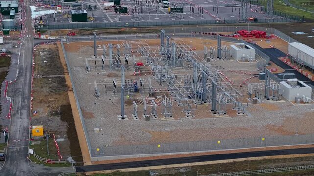 Aerial view of the Biggleswade National Grid 400/132kV Substation in Biggleswade, a sprawling grid infrastructure contrasting against the landscape, Biggleswade, United Kingdom.