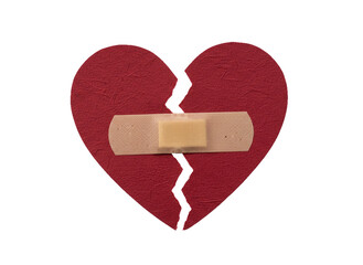 Broken red heart shape mended with adhesive bandage.