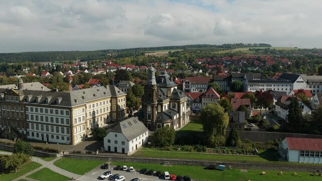 Scenic drone shot of a baroque Jesuit college and church complex in the historic town of Buren, North Rhine-Westphalia, Germany.