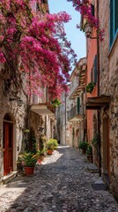Fototapeta premium A narrow cobblestone street in an Italian village decorated with spring flowers, looking up at the sky