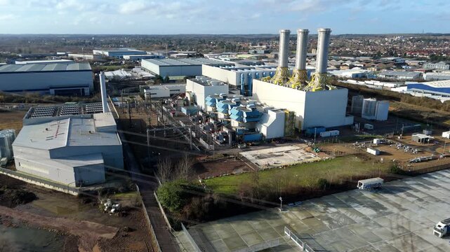 Aerial view of the Rye House Power Station, a juxtaposition of industrial architecture against a backdrop of Hoddesdon, United Kingdom.