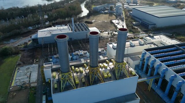 Aerial view of the Rye House Power Station, a symphony of industrial architecture against the backdrop of the landscape, Hoddesdon, United Kingdom.