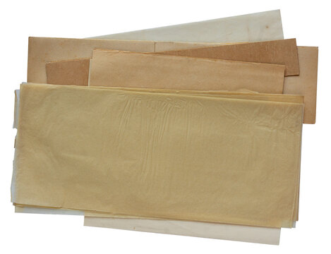 Stack of aged blank paper sheets and antique brown cardboard folders isolated on white background