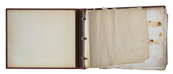 Open vintage photo album with blank aged pages and binder rings, isolated on white