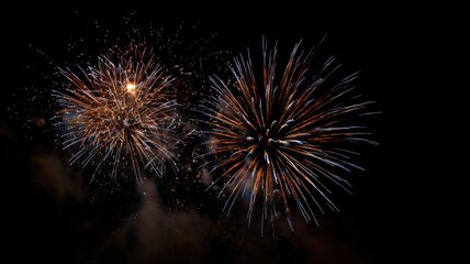 Vibrant Fireworks Display Against Dark Sky: Festive Celebration, Pyrotechnics, and Holiday Event Imagery