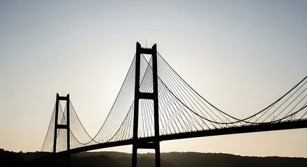 Obraz premium Silhouette of suspension bridge at sunset.