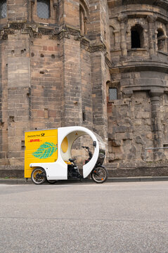 DHL decarbomile, electrical cargo bike to deliver parcels and letters in Trier, Germany, sustainability project to reduce CO2 emissions 