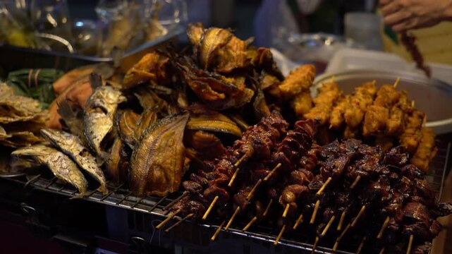 ight asian thai street market thai ffood mix fish and pork.
