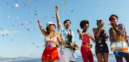 Obraz na płótnie Canvas Celebration on the beach with music and confetti