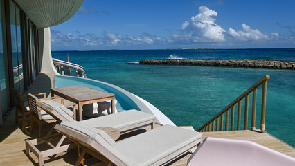 Obraz premium lounge chairs on a tropical resort