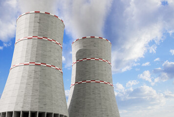 Cooling towers of nuclear power station against the blue sky