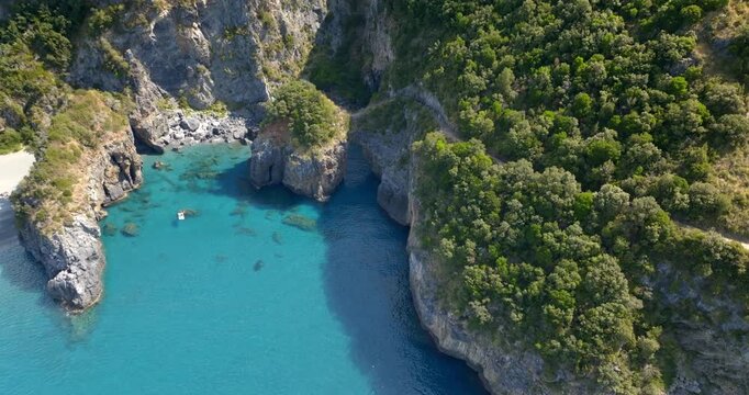 Aerial view of the Arcomagno of San Nicola Arcella on the Tyrrhenian coast of Calabria, Italy. It's a geological formation located along the beautiful italian coast. It has a crystal and turquoise sea