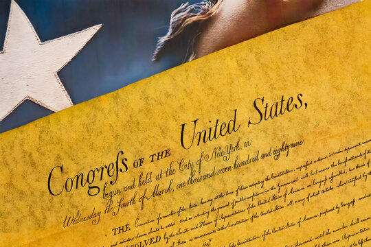 War torn American flag under the Delcaration of Independence  Illustrating Freedom
