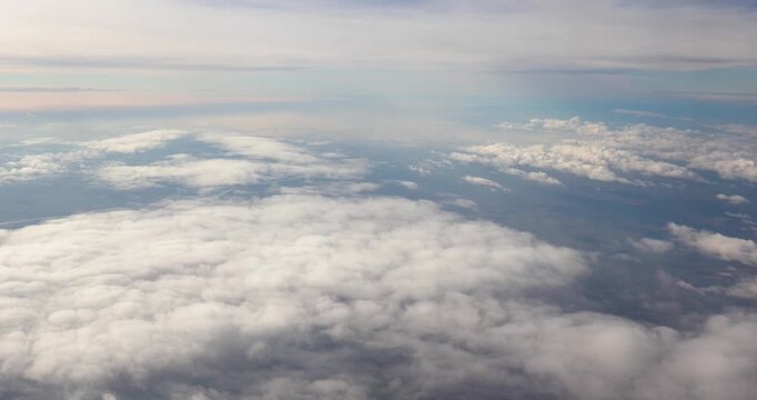 Flying above the clouds airplane window view