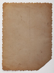 Fototapeta premium Vintage scalloped edge photo paper background. Aged and yellowed retro photo.