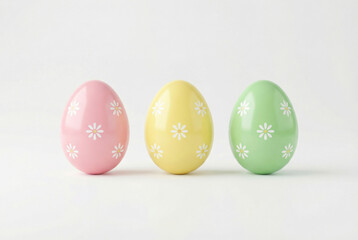 Obraz premium Decorative eggs in pink, yellow and green colors with white flower designs arranged on a plain background for a festive occasion