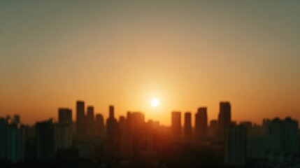 Obraz premium Golden sun setting behind city skyline, casting warm glow on bui