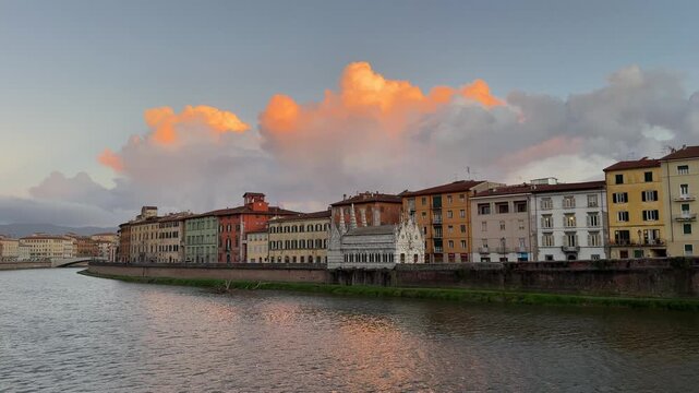 Sunset over the river Arno in Pisa city, Tuscany, Italy.