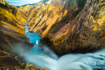 A waterfall in Yellowstone Park during the day