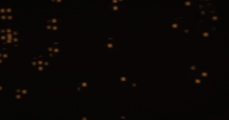 Blurred abstract yellow light patterns create a mysterious and dynamic effect on a dark background.