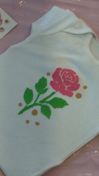 Timelapse of stenciled rose creation on tshirt: artistic crafting process in high definition