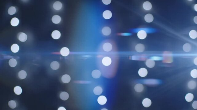 Bokeh lights create a soft background for a nighttime event at the city center in late summer