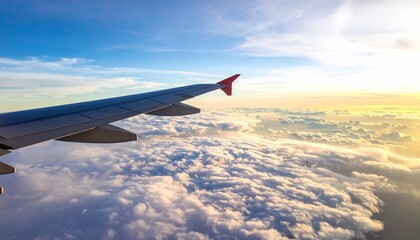Obraz premium View from an Airplane Window of a Wing Soaring Above a Sea of Fluffy White Clouds