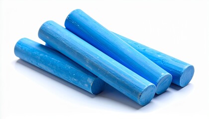 Close-up of four sticks of vibrant blue chalk, commonly used for drawing on blackboards or sidewalks, arranged neatly together and isolated against a clean, plain white background studio shot.