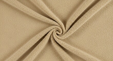 A tan-colored piece of fabric with a swirled design