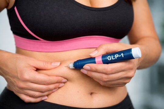  Woman Injecting GLP1 Agonist into Stomach for Weight Loss or Diabetes Treatment