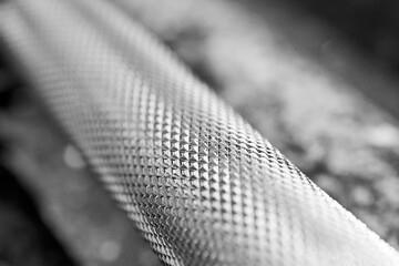 Closeup Of Textured Metal Surface With Knurling And Grid Pattern In Monochrome.