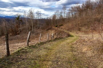 Fototapeta premium Rural road in the Balkan Mountains in early spring.